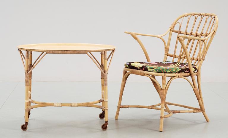 A rattan armchair and table attributed to Josef Frank, Svenskt Tenn.