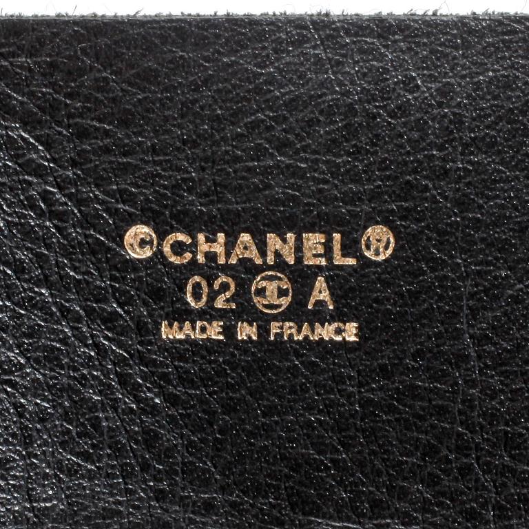 CHANEL, a felt and leather belt.