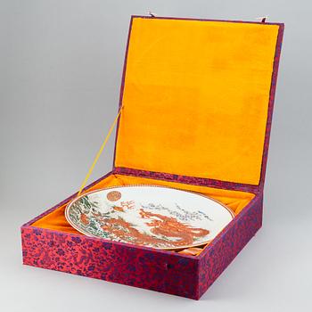 A large Chinese dish with a fierce five clawed dragon, modern.