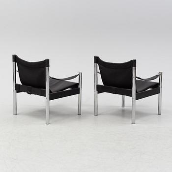 A pair of leather arm chairs, Johansson Design, late 20th Century.