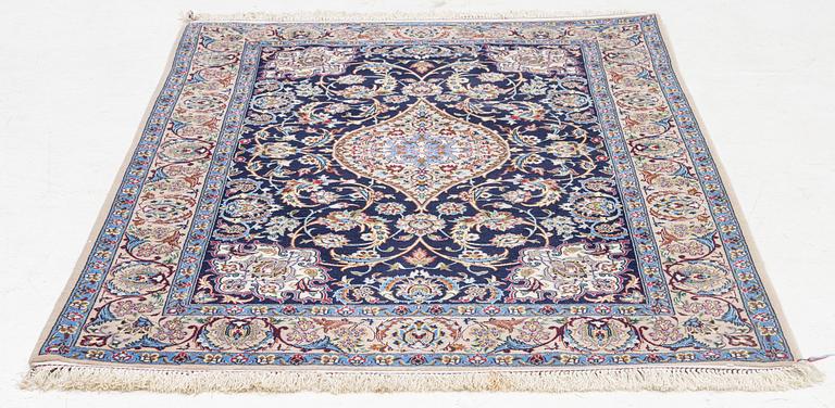 An Isfahan rug, signed, approx. 168 x 108 cm.