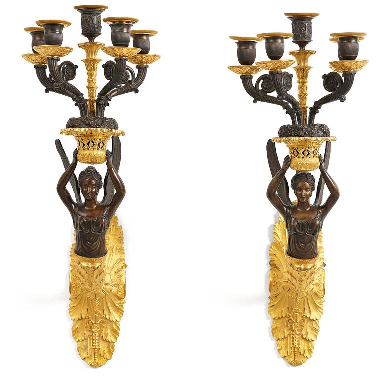 A pair of French Empire five-branch gilt and patinated bronze appliques, first part 19th century.