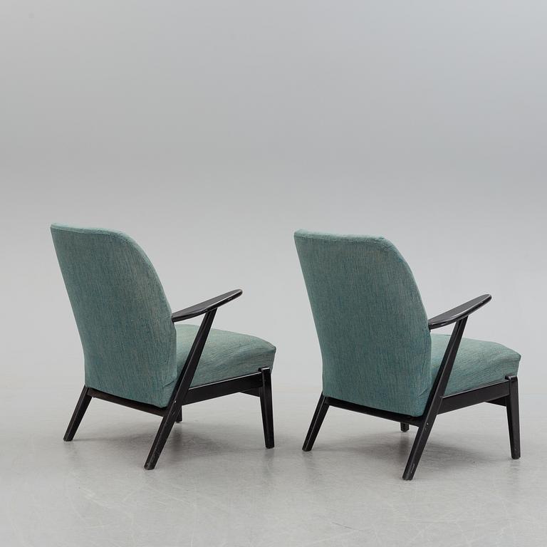 A pair of mid 20th century easy chairs.