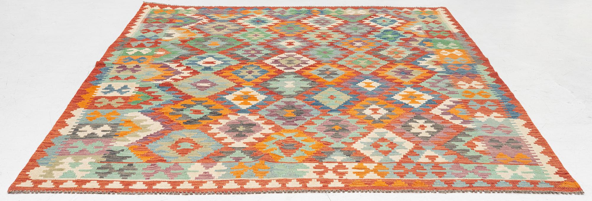 A kilim carpet, c. 295 x 203.