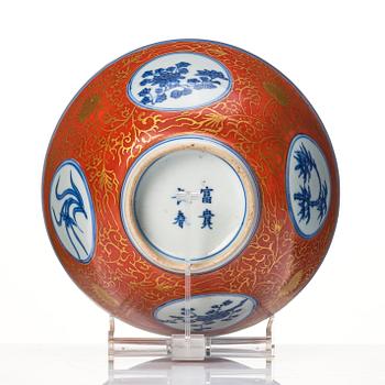 A blue and white bowl with coral red exterior, Japan, 19th century.