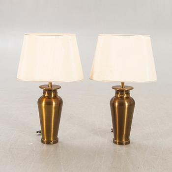 A pair of Deknut metall table lamps later part of the n20th century.