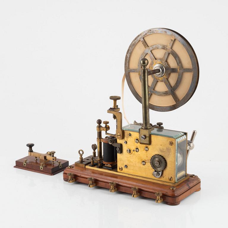 A telegraph from LM Ericsson, and a telegraph key from Digney Frères, early 20th century.