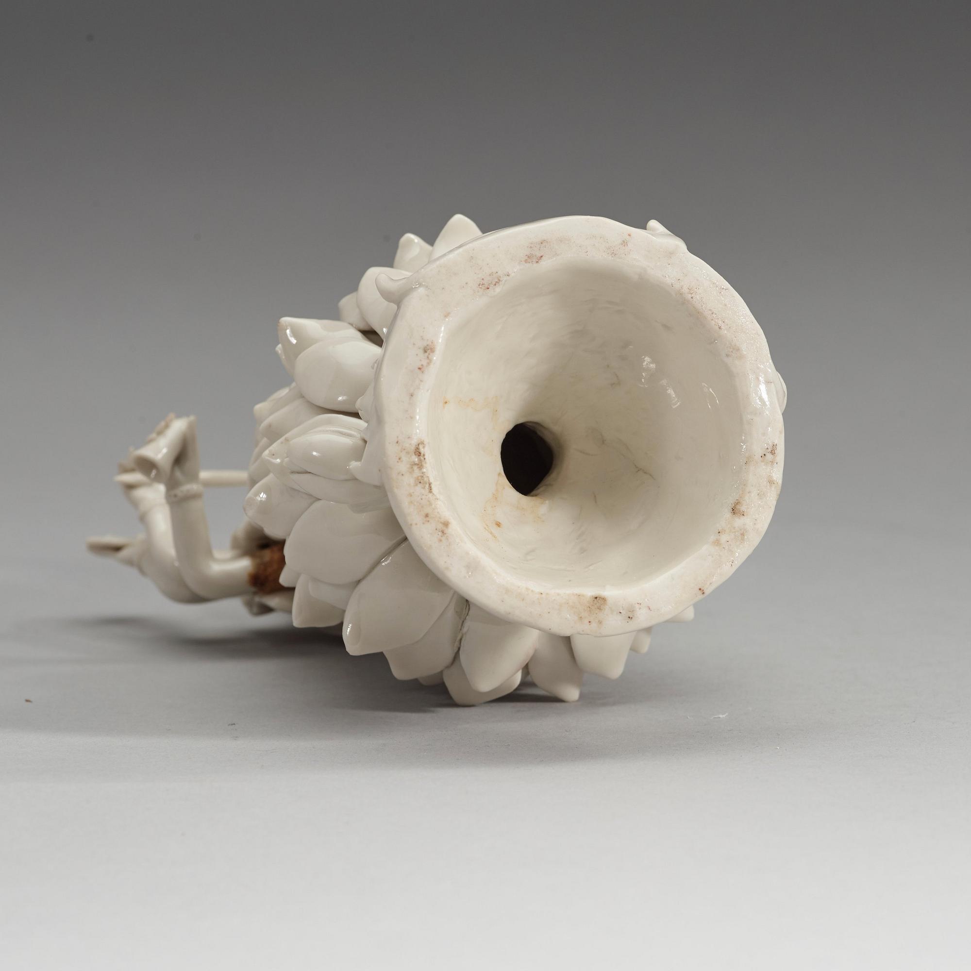 An eigth armed blanc de chine figure of a Bodhisattva, Qing dynasty, 19th Century.