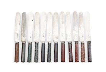 597. Twelve Swedish 19th centry porphyry knife handles.
