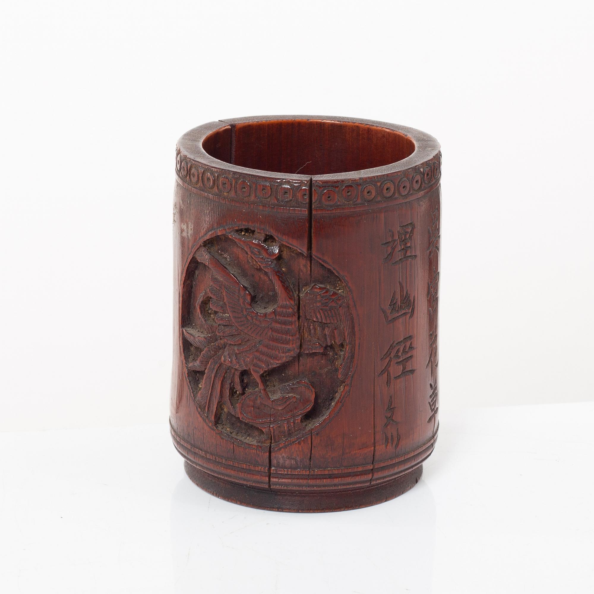 A Chinese bronze vase, joss stick holder and a bamboo brush pot, Qing dynasty.