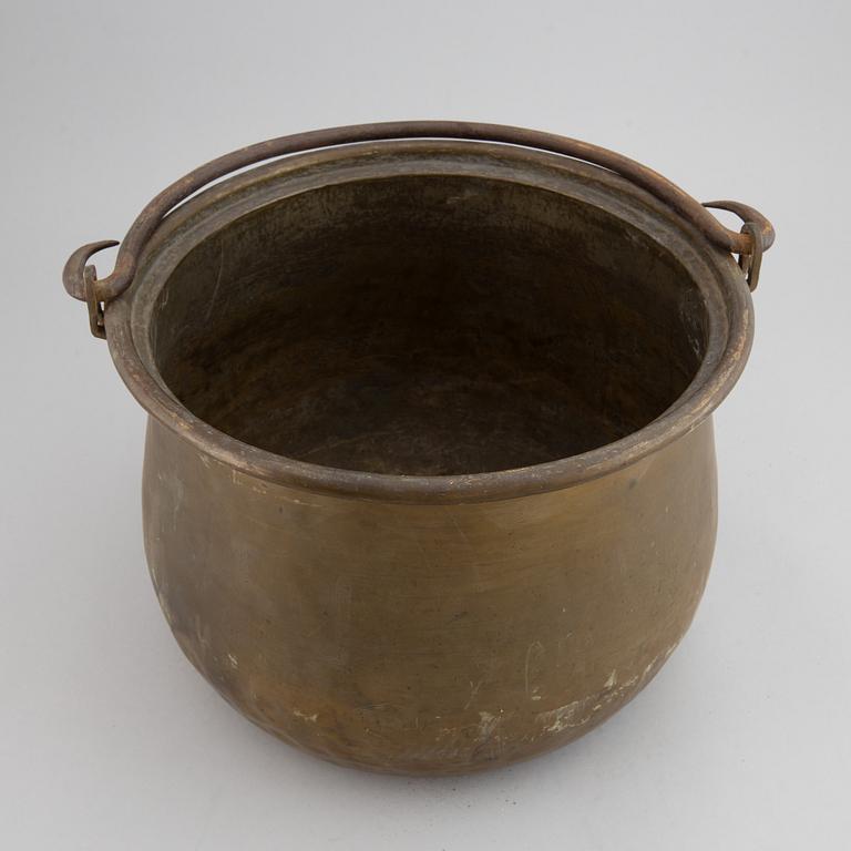 A large 18th century brass cauldron.