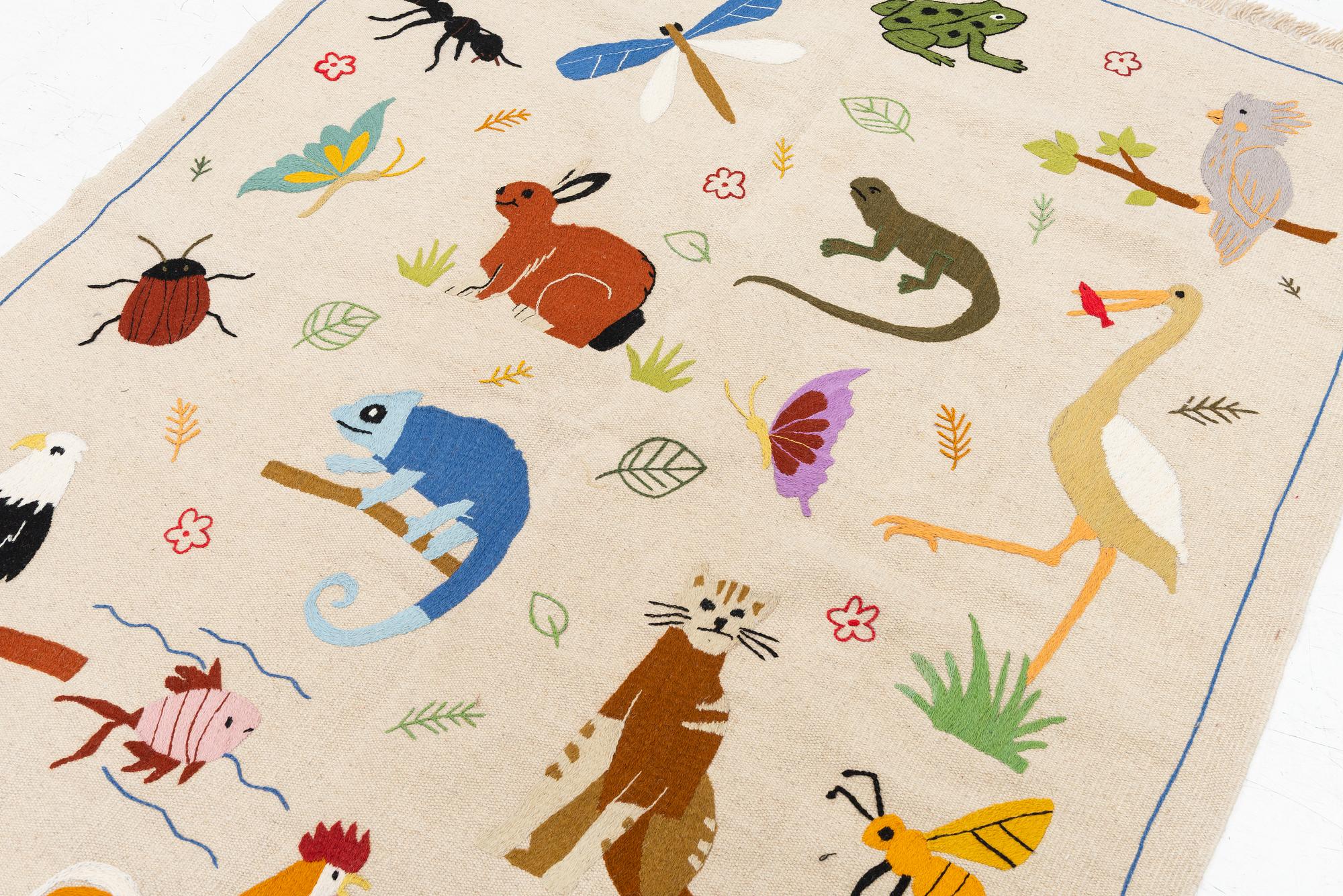 A hand-embroidered Kelim carpet, c. 200 x 147 cm.