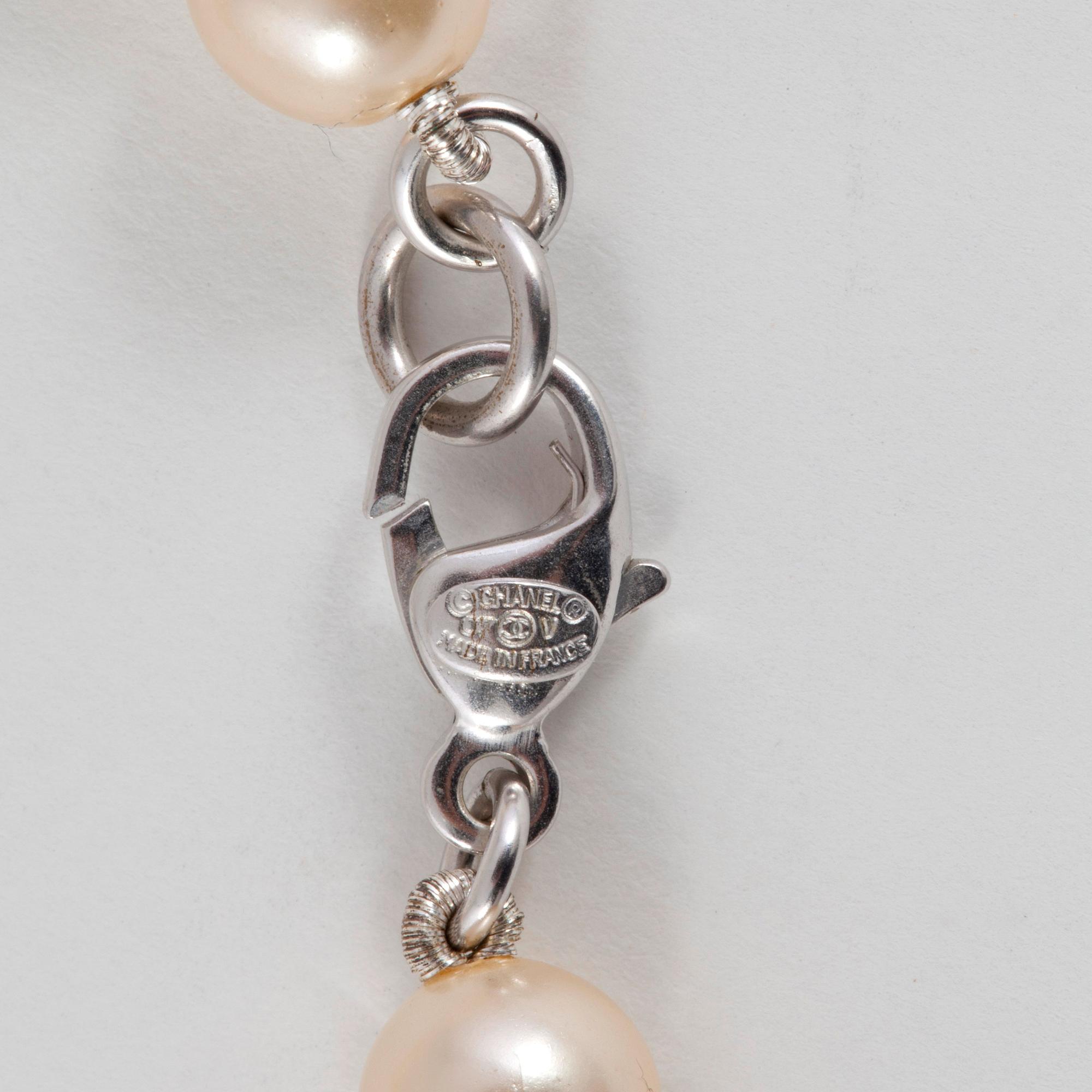 CHANEL, a decorative pearl necklace.