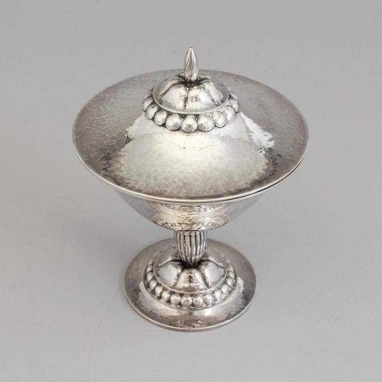 A Swedish Art Nouveau silver lidded bowl on stand, maker's mark CF Carlman, Stockholm, 1919.