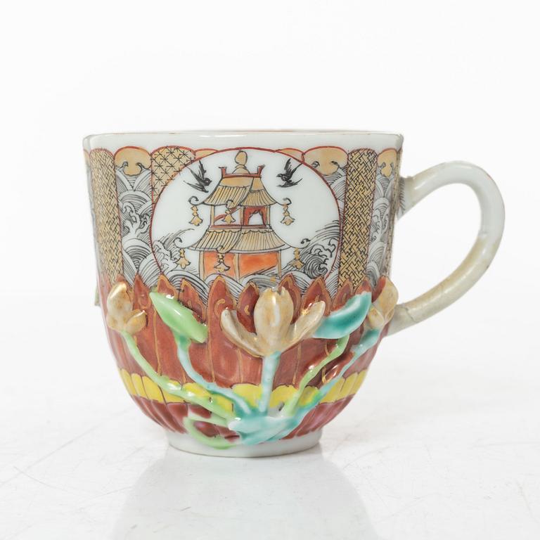 A small Chinese famille rose porcelain tureen with cover and stand, two salt cellars, Qing dynasty, Qianlong (1736-95).