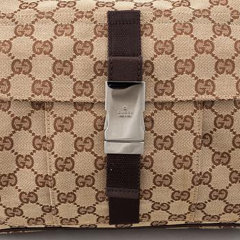 Gucci, a monogram canvas messenger bag.