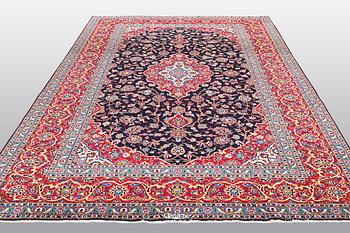 A carpet, Kashan signed Najafi, ca 360 x 231 cm.