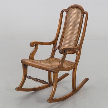 A ROCKING CHAIR LATER PART OF THE 19TH CENTURY.