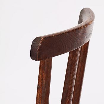 Axel Einar Hjorth, a set of four stained pine 'Utö' chairs, Nordiska Kompaniet Sweden 1930's.