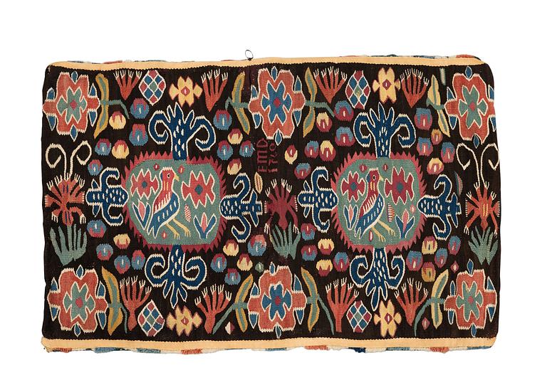 A carriage cushion, "Den innelykta fågeln"  tapestry weave, ca 54 x 87 cm, Scania, 1760, signed EMD.