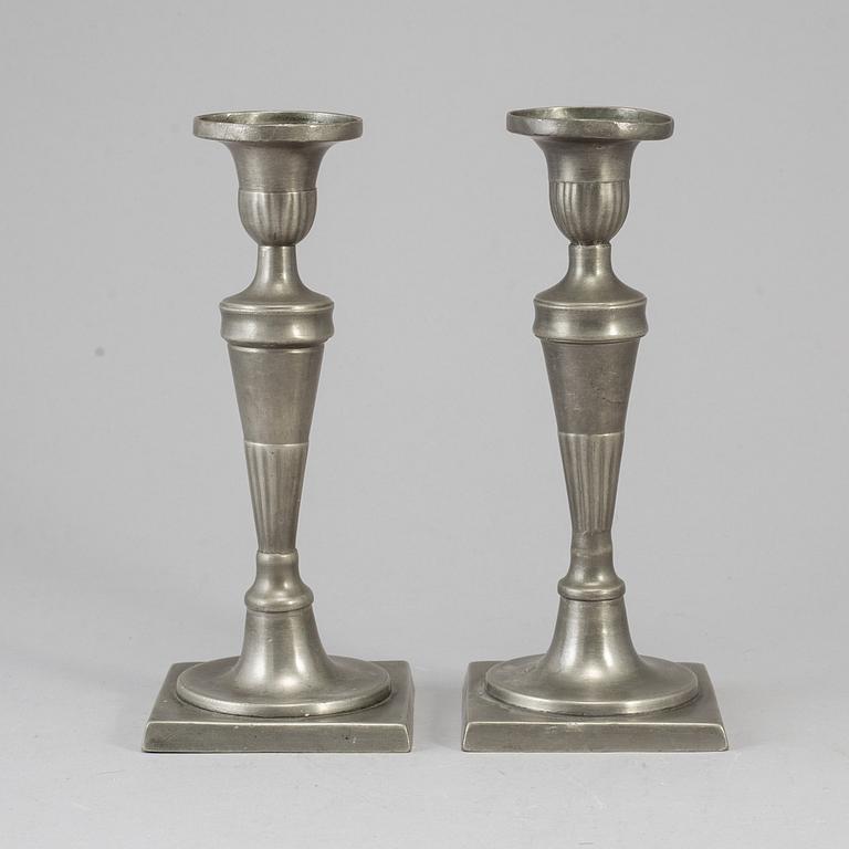 A pair of 18th century pewter candlesticks.