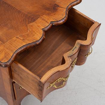 A Rococo-style chest of drawers, 19th century.