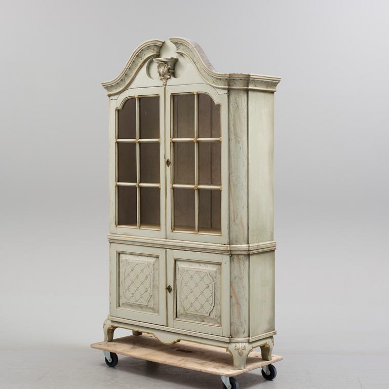 a rococostyle vitrine cabinet from the 19th century.