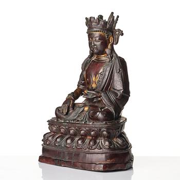 A bronze sculpture of a crowned Buddha, presumably late Ming dynasty, with an inscription dating it as 1530.