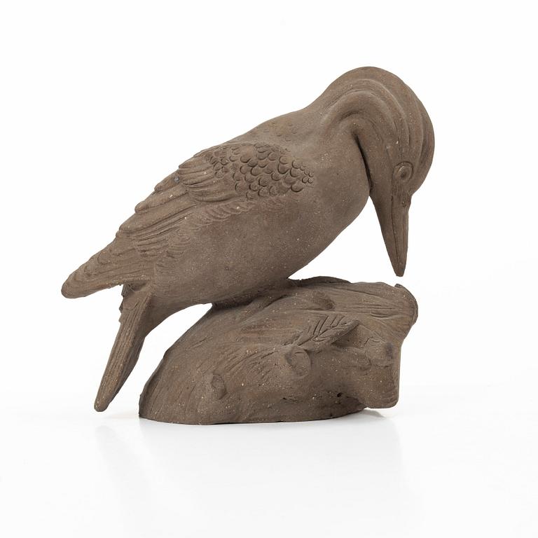 Tyra Lundgren, a stoneware sculpture of a woodpecker, executed in her own studio.