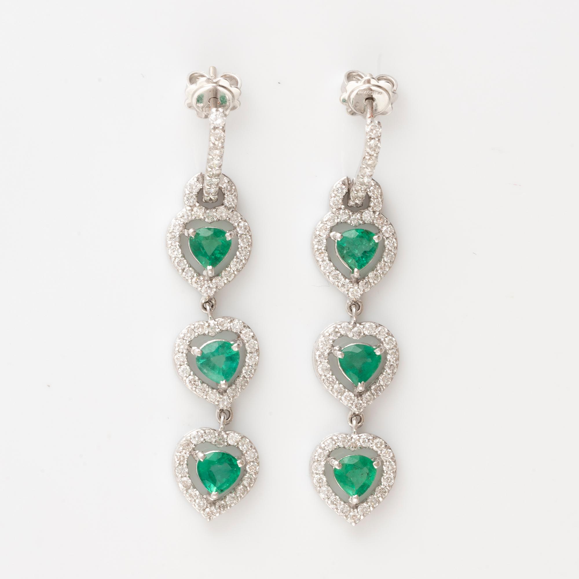 Emerald and brilliant cut diamond earrings.
