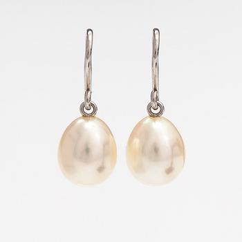 A pair of 18K white gold earrings with drop shaped cultured pearls. Schoeffel.
