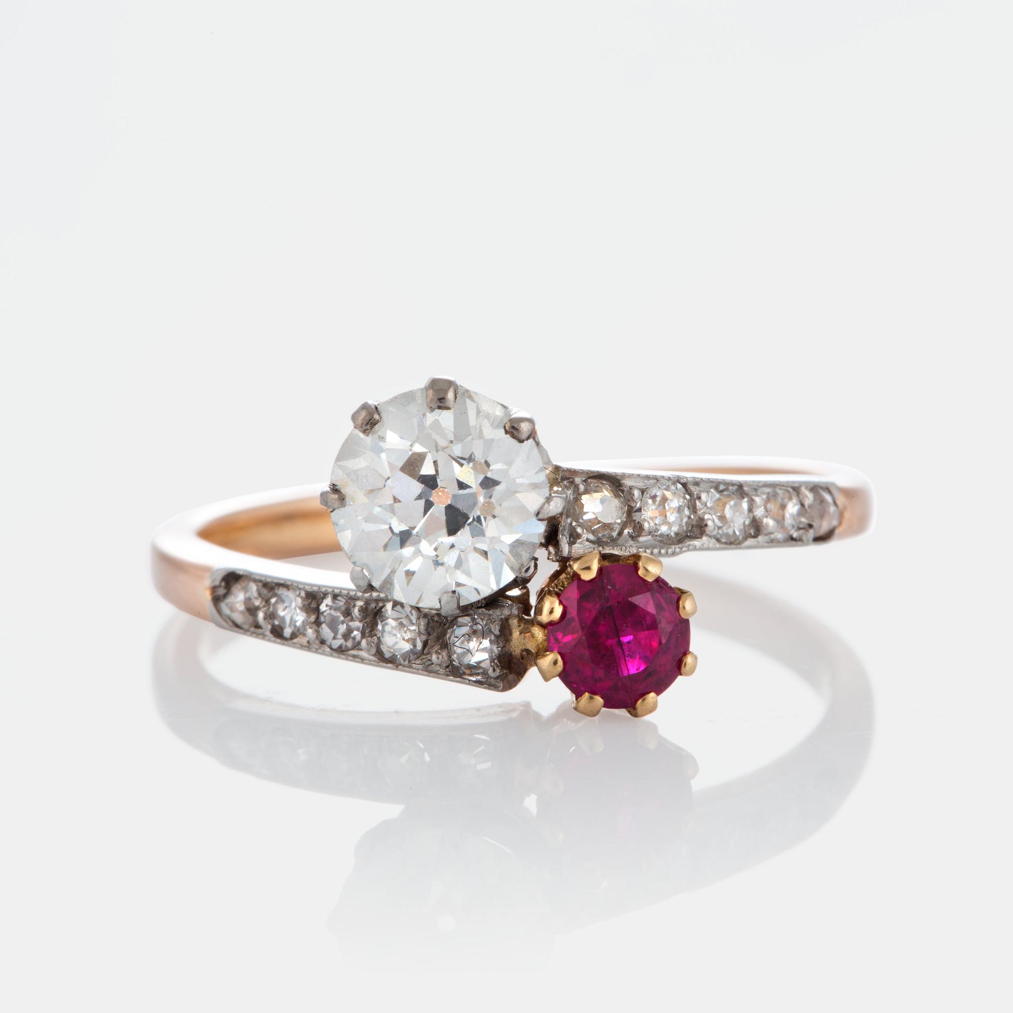A ring set with an old-cut diamond ca 0.75 ct quality ca K-L vs and a faceted ruby.