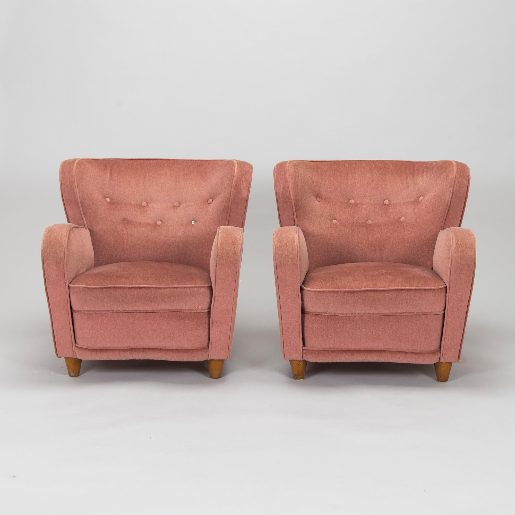 A pair of mid-20th century armchairs.