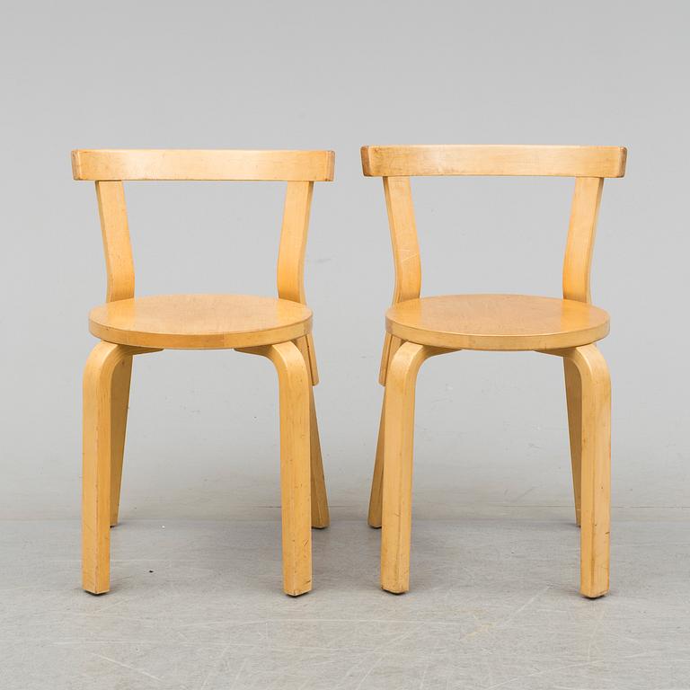 Nine model 68 chairs by Alvar Aalto, designed in 1935.