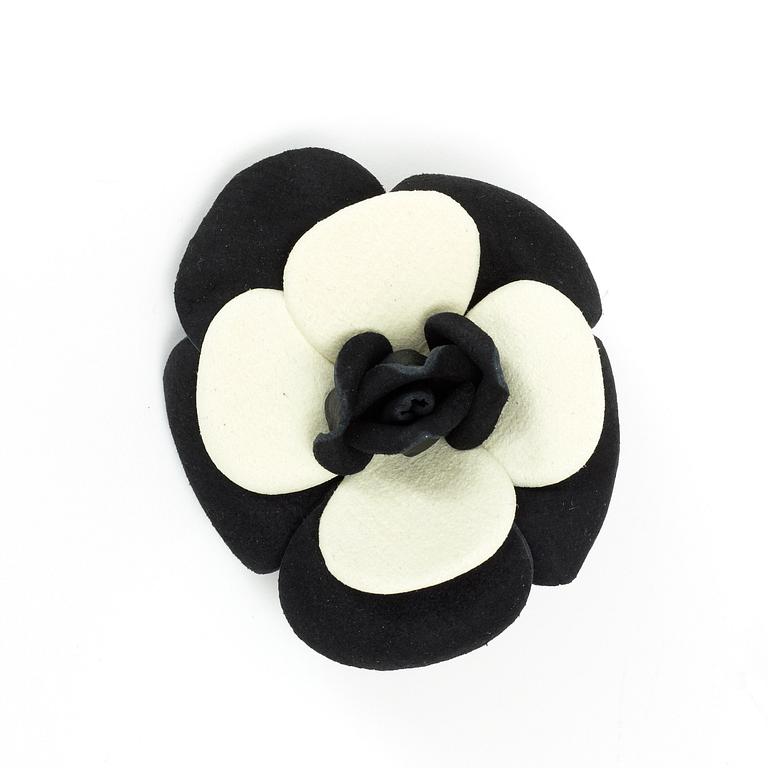 A brooch by Chanel.