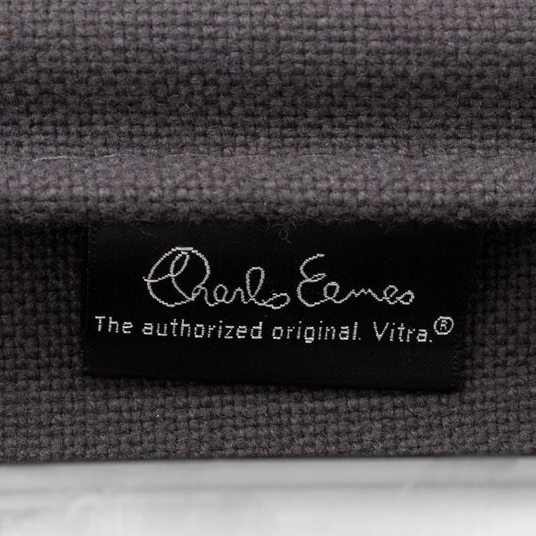 An 'EA 104 Swivel' armchair by Charles & Ray Eames, Vitra, 2007.