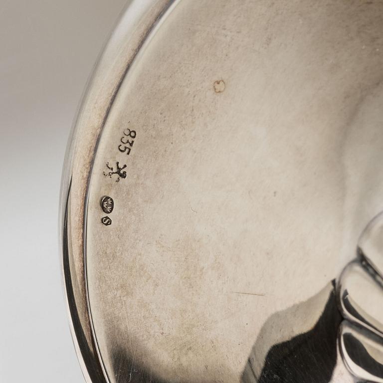 A pair of silver candle sticks, first half of the 20th century.