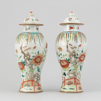 A pair of famille rose vases with covers, Qing dynasty, Qianlong (1736-95).