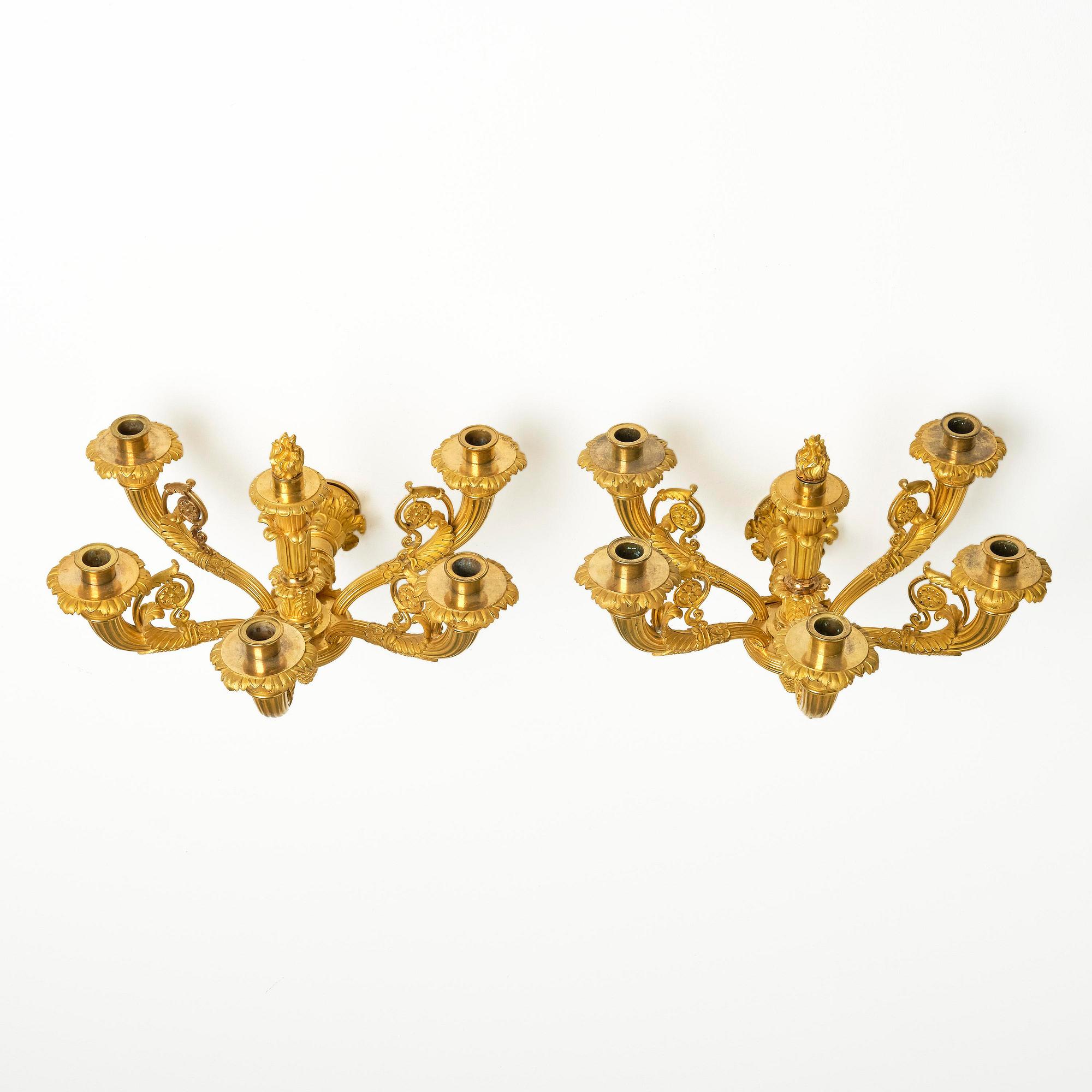 A pair of French Empire six-branch ormolu appliques, ca 1820's.