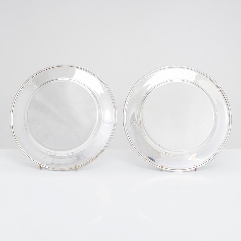 A 12-piece set of silver chargers, makers' marks of Hugo Grün, S.H. Jörgensen..., Denmark, around mid-20th century.