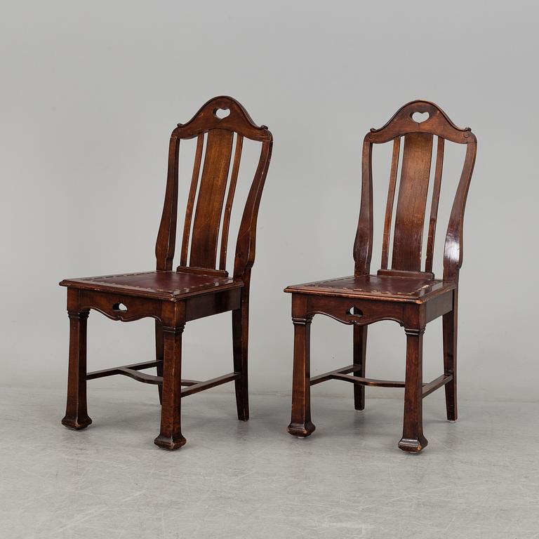 A late 19th century dining table with ten chairs and five extension leaves.