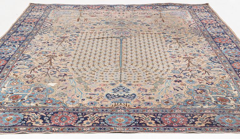 An oriental carpet, circa 350 x 295 cm.