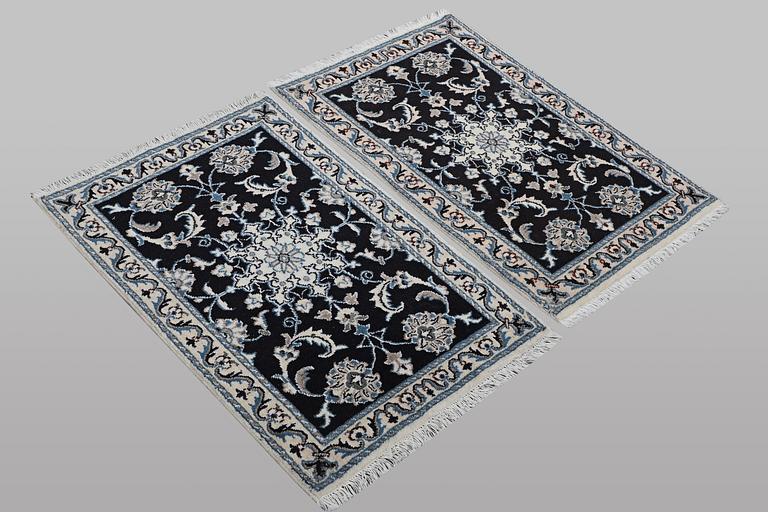 A pair of rugs, Nain, part silk, ca. 90 x 59 cm & ca. 89 x 58 cm.