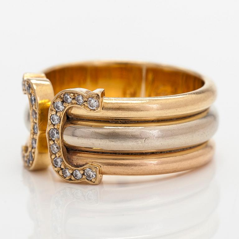 Cartier, ring "Double C" in 18K tri-coloured gold with round single-cut diamonds.