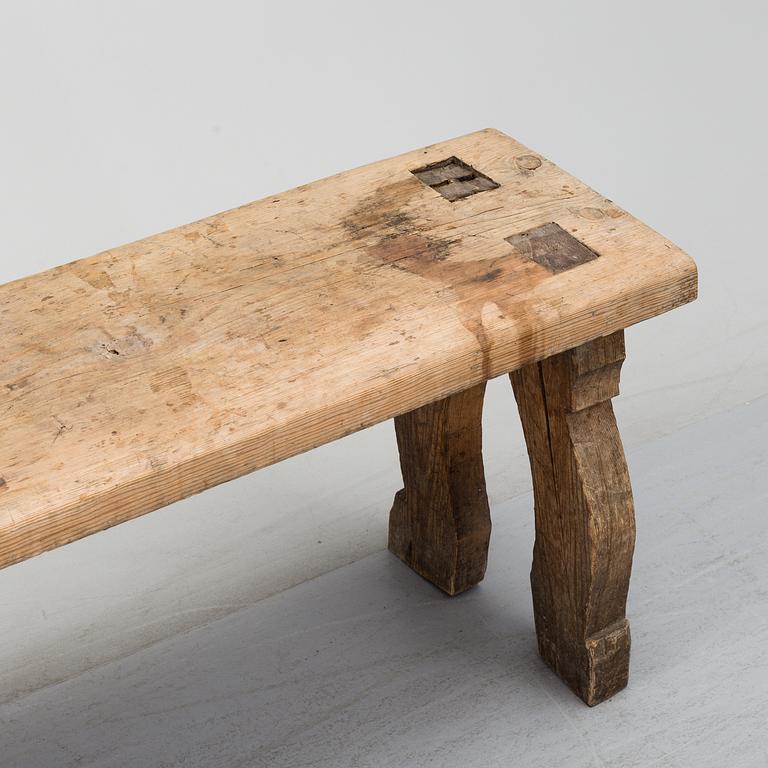 A 19th century folk art bench.