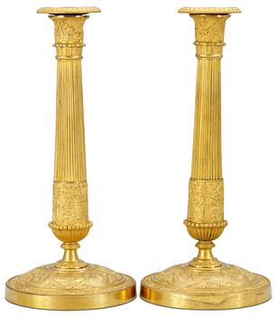 1048. A pair of Empire candlesticks.