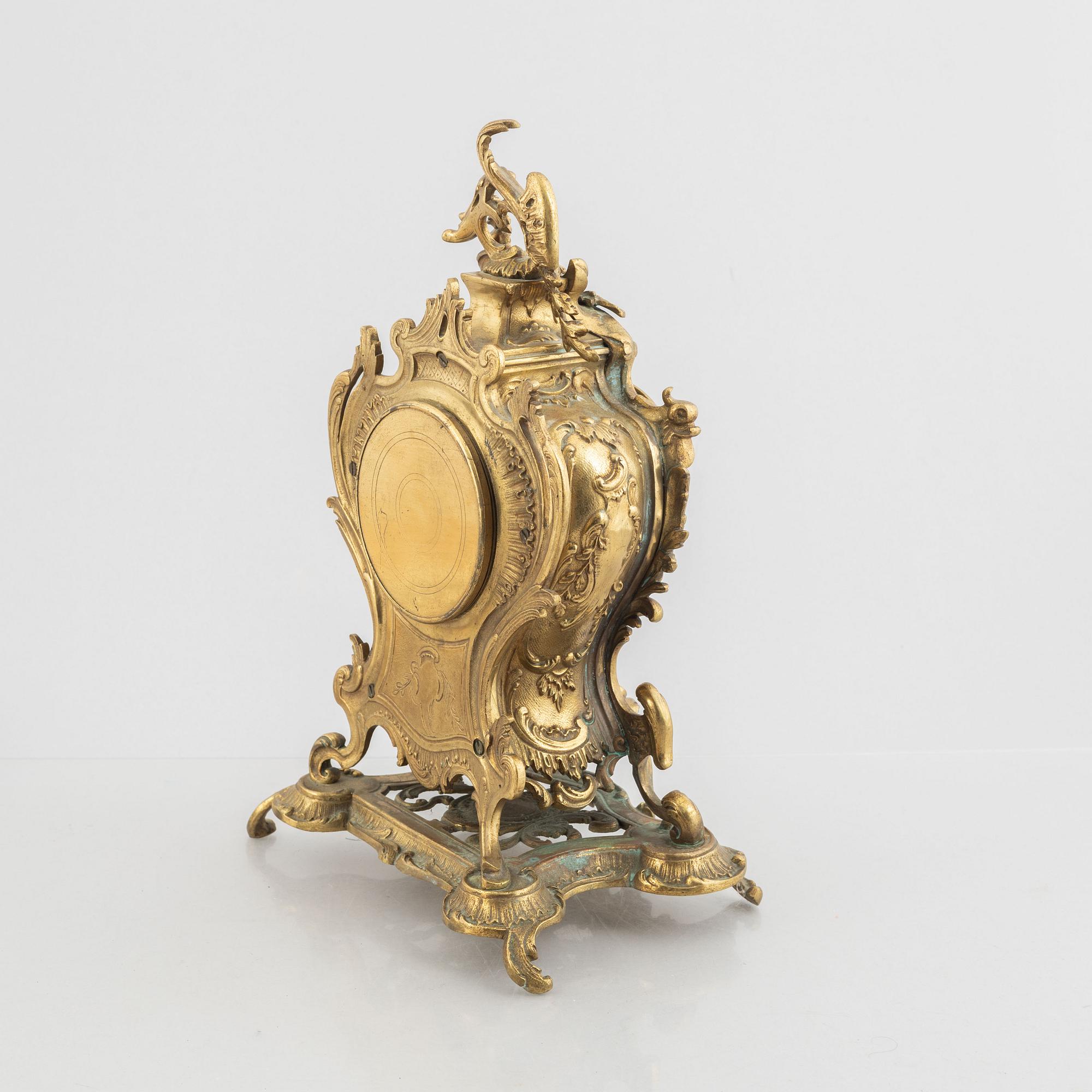 A Rococo Revival mantel clock, late 19th Century.