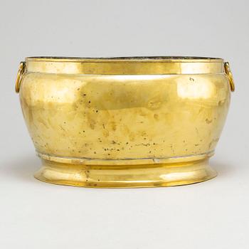 A brass champagne cooler, possibly 17th Century.