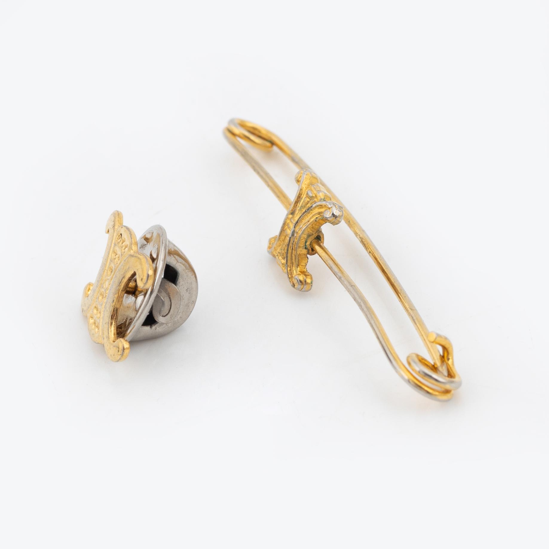 Céline, a set of four gold tone brooches.