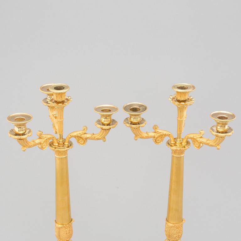 A PAIR OF LATE EMPIRE ORMOLU CANDELABRA, first half of the 19th century.